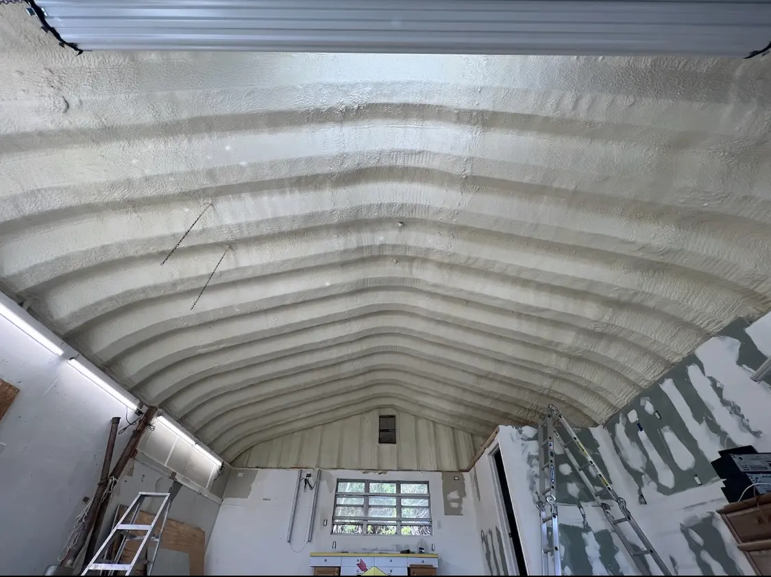 Spray polyurethane foam applied to the underside of a metal roof deck in Rossford